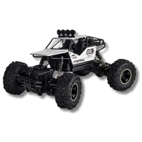 White Off-road RC car with large tires and rugged frame.