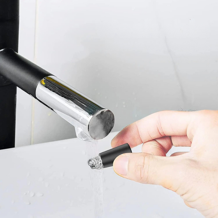 The detachable head of the grooming tool being washed under running water, emphasizing its waterproof feature for easy cleaning and maintenance.