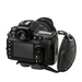 Black DSLR camera fitted with the black padded hand strap, showing how the strap attaches to the camera's side.