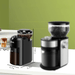 The grinder is positioned on a kitchen counter with its dimensions displayed: 7.4 inches in height, 6.3 inches in width, and 3.7 inches in depth. Another grinder is blurred in the background for comparison.