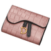 A close-up of a pink crocodile-pattern wallet with a gold "D" buckle, isolated on a white background.