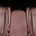  Top-down view of two car seat gap fillers in a car, fitted between the seats and the center console.