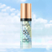 A bottle of SADOER sunscreen with SPF 50 and PA+++, featuring a gold cap and filled with green, blue, and white beads, set against a cloudy sky background.