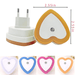 A heart-shaped night light with a unique white and orange color scheme, measuring 2.55 inches in both width and height, accompanied by visuals of similar night lights in white, blue, pink, and orange.