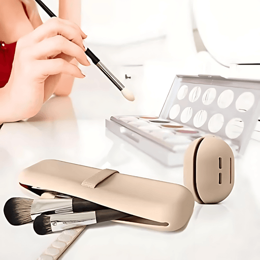 The cosmetics holder and the makeup sponge holder are beige in color, placed on a white surface while in the background you can see the hands of a woman in a red shirt, when she is applying makeup with the make-up kit placed in front of her.