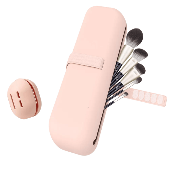 Pink cosmetics holder and make-up sponge holder. Ideal to keep the beauty on travels and trips. Display on white background.