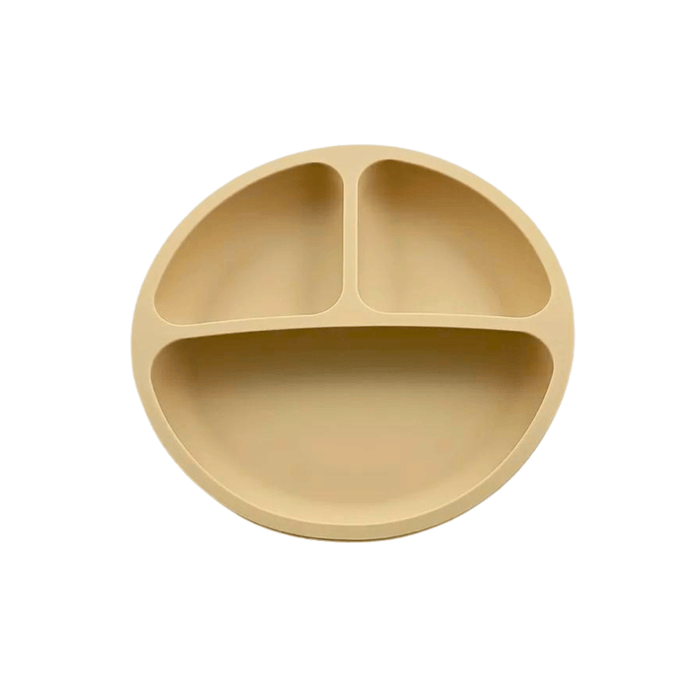 Simple and functional beige silicone plate for children, featuring a three-compartment design to separate different types of food, encouraging balanced meals and independent eating.