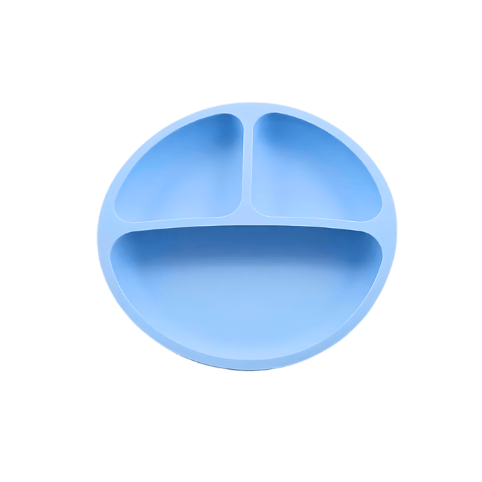 Simple and functional blue silicone plate for children, featuring a three-compartment design to separate different types of food, encouraging balanced meals and independent eating.