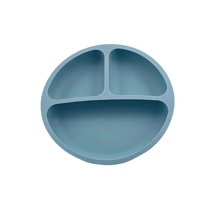 Simple and functional gray-blue silicone plate for children, featuring a three-compartment design to separate different types of food, encouraging balanced meals and independent eating.