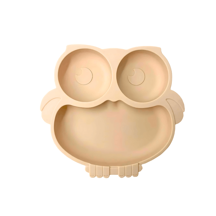 Adorable biege owl-shaped silicone plate designed for toddlers, featuring two small compartments for sides or dips and a larger main compartment for entrees. The playful owl design makes mealtime fun and engaging for young children.