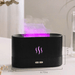 A black aroma diffuser with a pink-purple mist emanating from it. Dimensions displayed are 2.95 inches in depth, 6.73 inches in width, and 3.97 inches in height. The diffuser has a control panel with two buttons.