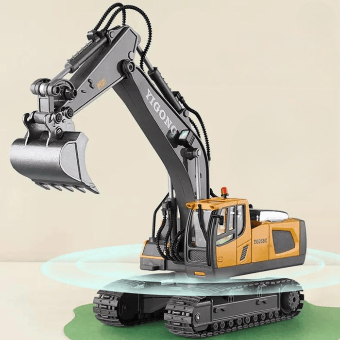 Detailed view of a stationary toy excavator with its arm raised, showing tracks and hydraulic hoses. The excavator is yellow and grey.