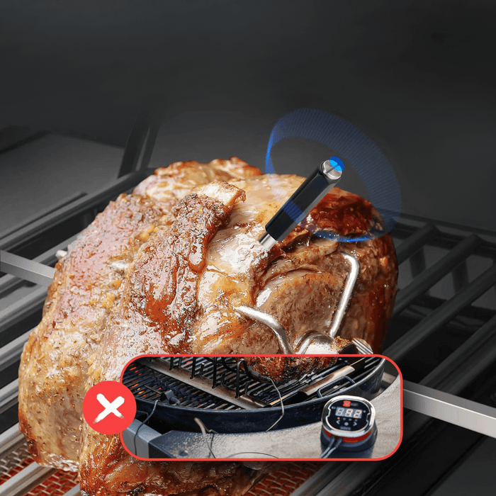 A wireless smart meat thermometer inserted into a roast on a grill, highlighting its use without tangled wires.