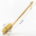 A long-handled bath scrubber with dimensions clearly marked. The handle is 16.14 inches long, and the scrubber head is 4.72 inches wide and 2.55 inches thick. The handle is made of wood, and the scrubber head has a strap for hand-held use.