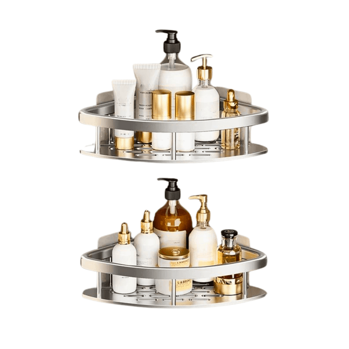 Two silver corner shelves loaded with various white and gold bottles and toiletries. The background of the image is white.