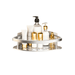 A silver corner shelf loaded with various white and gold bottles and toiletries. The background of the image is white.