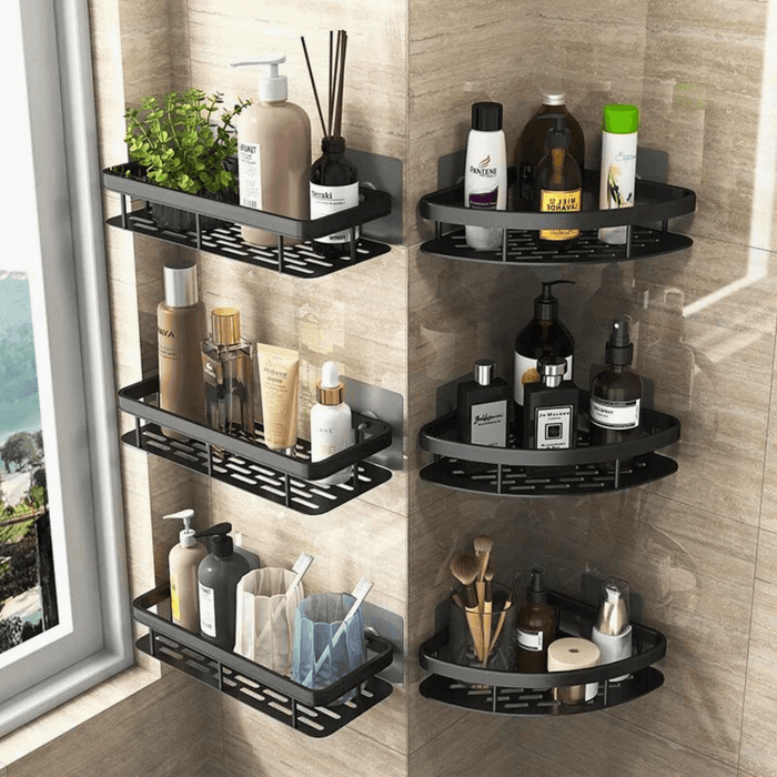 Six black wall-mounted shelves arranged in a corner, each loaded with various bottles, toiletries, and a small plant. The background of the image is a beige tiled wall.