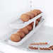 A white egg holder filled with brown eggs, placed inside a refrigerator with an additional white egg holder shown below. The background of the image is white.