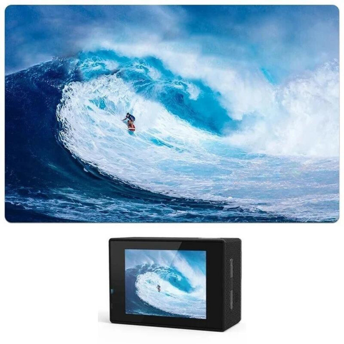 A compact action camera capturing a high-definition image of a surfer riding a massive ocean wave.