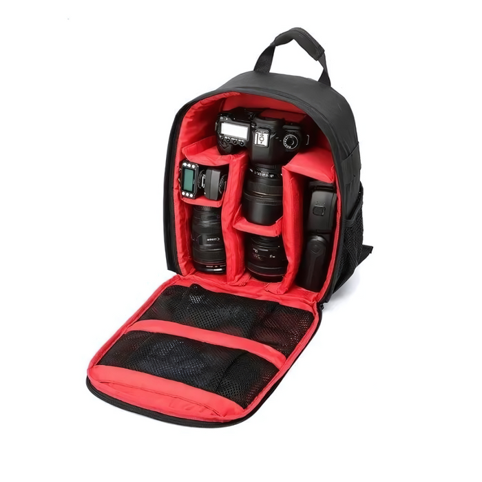 Open camera backpack with a red interior, showing compartments for a camera, lenses, and accessories.