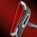 A close-up of the jaws of a pair of pliers. The pliers have a sleek black and silver design with the brand name "AIRAJ" visible on the handle. The jaws are open, revealing their serrated gripping surface, set against a red background.