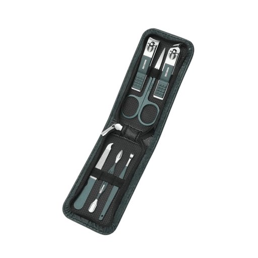 Black and green manicure set with tools neatly arranged inside the open case. Display on white background.