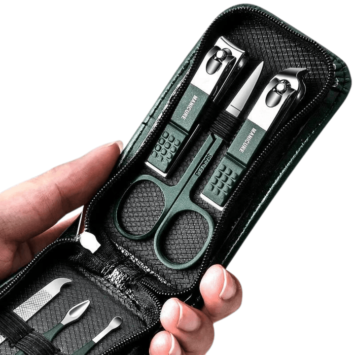 Hand holding a green and black manicure set in a zippered case.