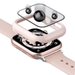 An exploded view of a smartwatch with a rose gold case and pink strap, showing the watch face, a protective case, and a tempered glass screen protector above it. Black spheres illustrate the impact protection provided by the screen protector.