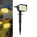 Black solar light with yellow illumination mounted on a wall and in other image stuck in the ground.