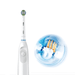 A white Oral-B electric toothbrush with its head displayed at the top and a power button clearly visible. To the right, a detailed close-up graphic illustrates the toothbrush head with multi-colored bristles encapsulated in a water bubble, highlighting the cleaning action of the bristles with water splash effects, set against a clean white background. This artistic representation emphasizes the toothbrush's effectiveness in cleaning and reaching between teeth.