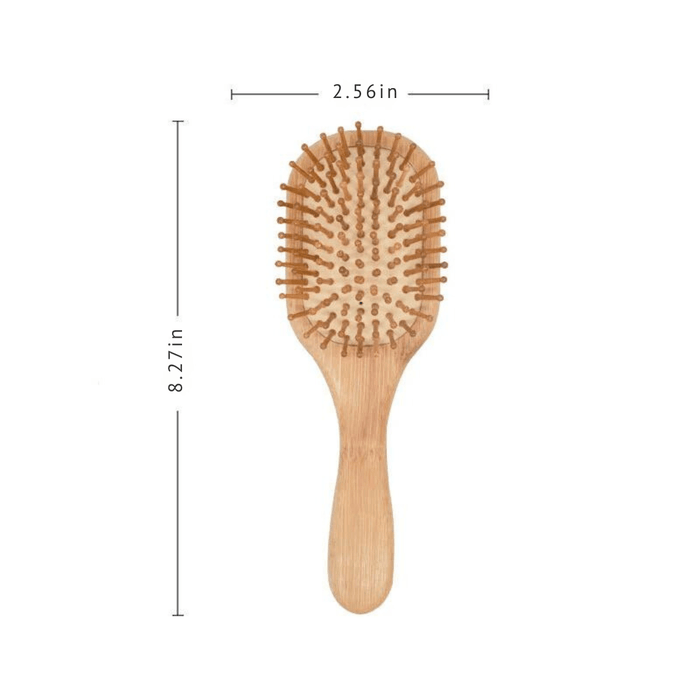 A bamboo hairbrush with an oval shape and wooden bristles, measuring 8.27 inches in length and 2.56 inches in width.