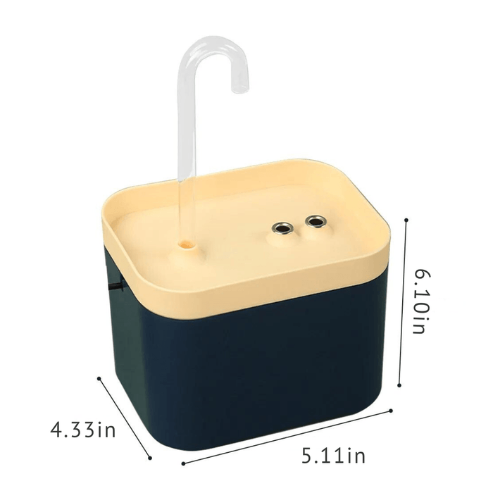 A dark blue pet water fountain with a light beige top, featuring a clear curved spout and two small circular sensors or buttons. Dimensions are shown: 6.10 inches in height, 5.11 inches in width, and 4.33 inches in depth.