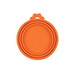 A close-up of a single orange silicone can lid. The design features multiple rings, allowing it to fit cans of different diameters, and it includes a tab for easy removal.