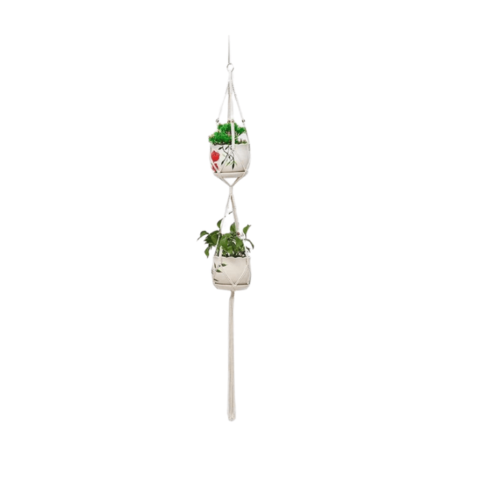 A single macrame plant holder with two tiers, each holding a white pot with green plants. The top pot has a design with brown dripping glaze.