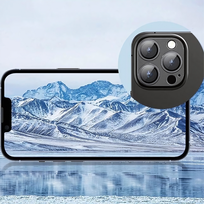 iPhone with camera lens protector and a mountain landscape background.