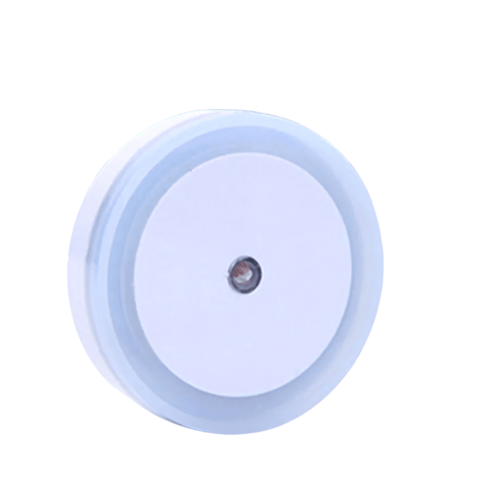 A circular night light with a white frame and a white center, designed to provide soft ambient lighting. Display on white background.