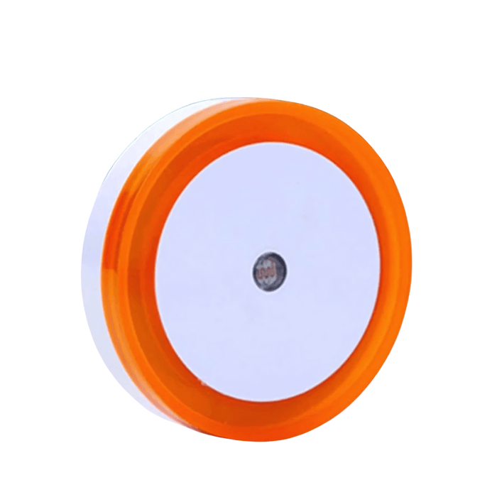 A circular night light with a orange frame and a white center, designed to provide soft ambient lighting. Display on white background.