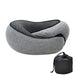 A close-up of the gray neck pillow paired with its black drawstring storage bag, highlighting the pillow's ergonomic shape and soft fabric.