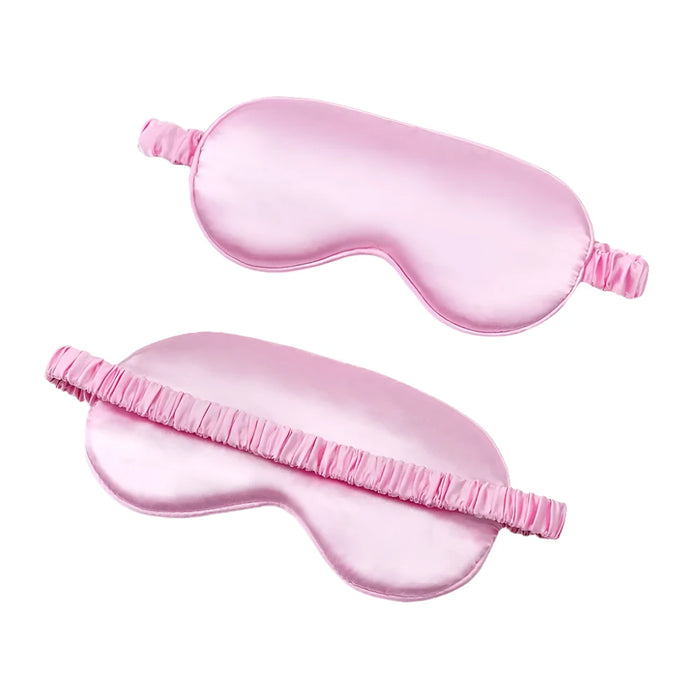 Pink sleep eye mask shown from front and back.