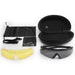 a complete set of black tactical sunglasses, including three interchangeable lenses (yellow, clear, and grey), a tan frame, a protective hard case, a soft pouch, a cleaning cloth, and an adjustable strap. The set is designed for versatile use in various lighting conditions and provides convenient storage and maintenance options.