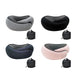 Four different color options of the travel neck pillow (gray, black, navy blue, and pink) are displayed, each with a black drawstring bag beside it for storage.