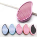 A collection of ergonomic foot files in various colors, including pink, blue, and black, with textured surfaces.