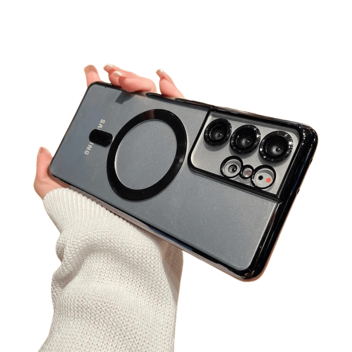 A phone case with a black magnetic ring held in hand, illustrating the stylish design.