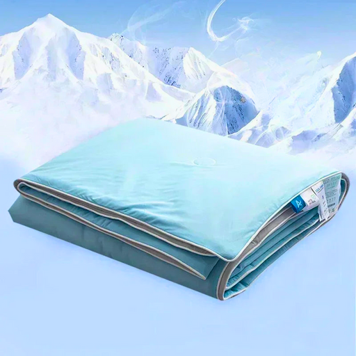 Folded cooling blanket in a snowy mountain setting.