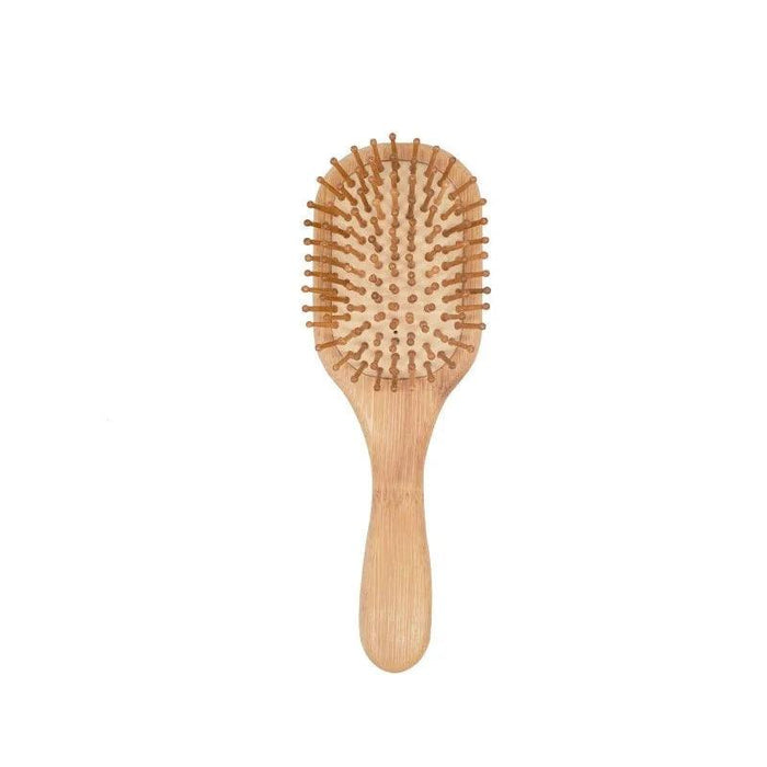 A bamboo hairbrush with an oval shape and wooden bristles.