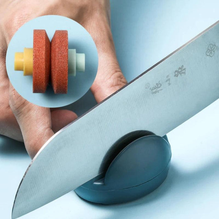 a close-up of the sharpening wheels inside a blue sharpener, with a knife being sharpened on the wheels. The inset highlights the grinding wheels used for sharpening.