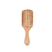 A bamboo hairbrush with a rectangular paddle shape and wooden bristles.