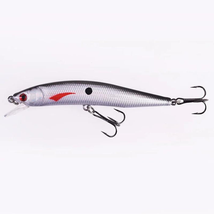 A full side view of the silver fishing lure, showcasing its entire body and treble hooks, designed to mimic a small fish.