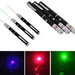 A set of four black laser pointers with red, green, and blue beams, including a close-up of the light dots in different colors.