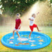 Two children enjoy the splash mat, with water spraying up around them as they play.